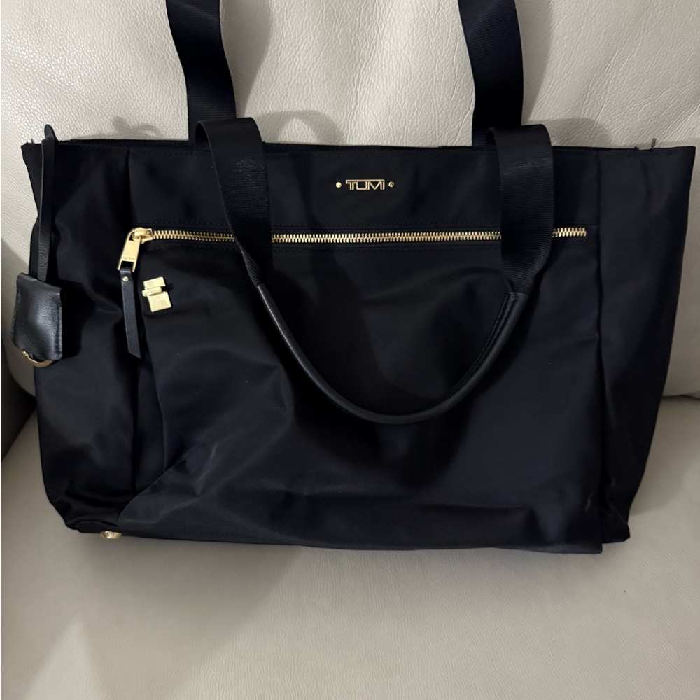 Tumi Black Tote Bag with Gold Hardware and Structured Design